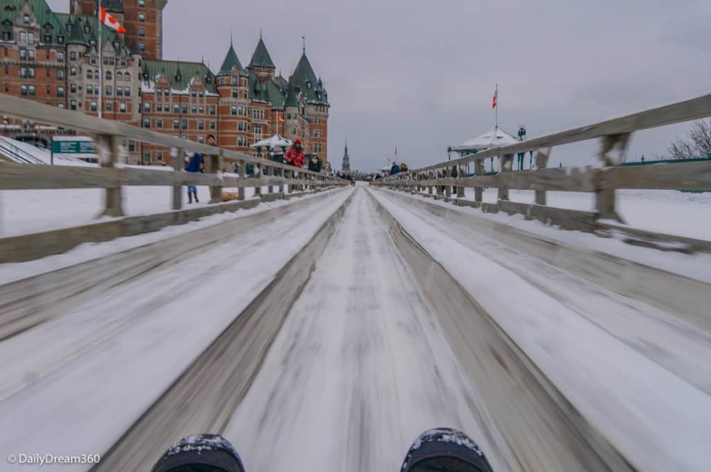 Gliding into end of Quebec City Toboggan Ride with Chateau Frontenac in background