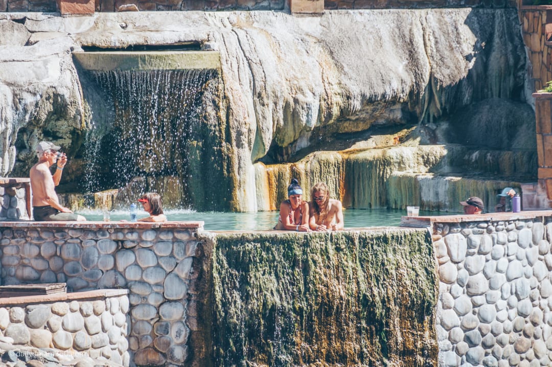 Couple looking out of hot spring in Pagosa Springs Colorado