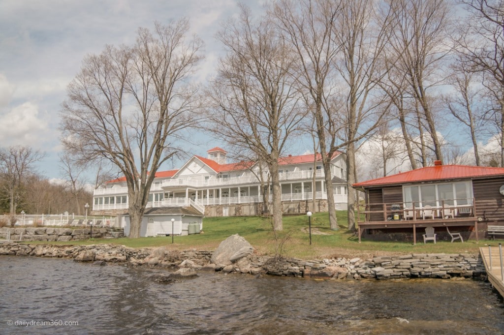 View of Viamede resort from water the main building and a small cottage